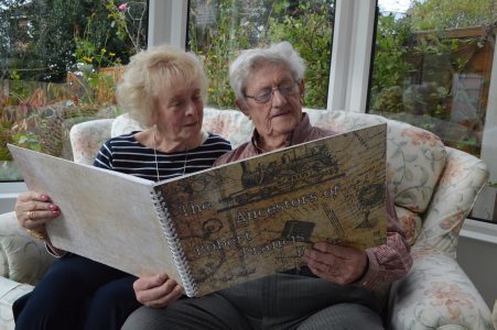 Mr and Mrs Boyle perusing their family history book